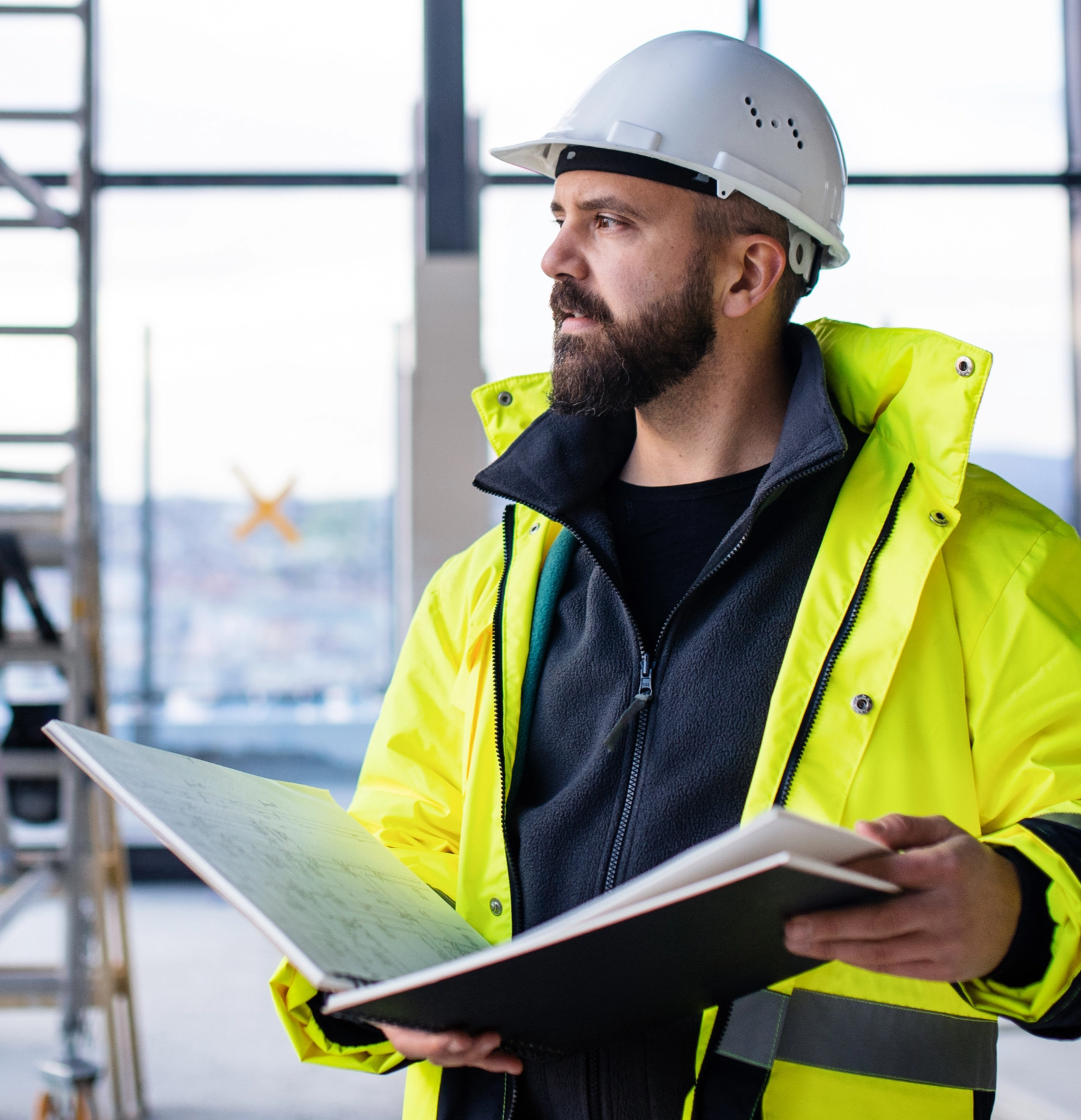 construction worker holding binder